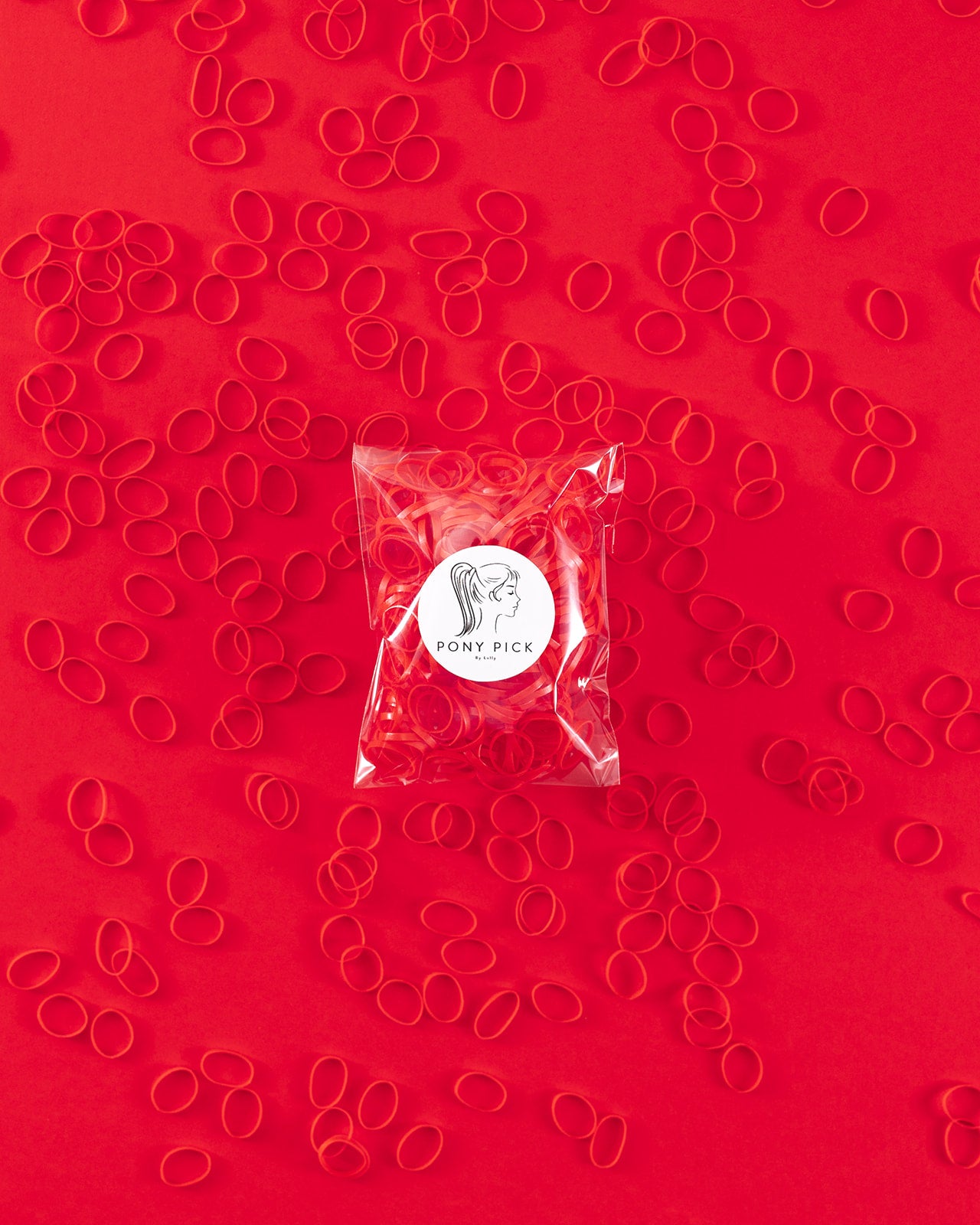 Colored Plastic Elastics: red, purple, white, pink